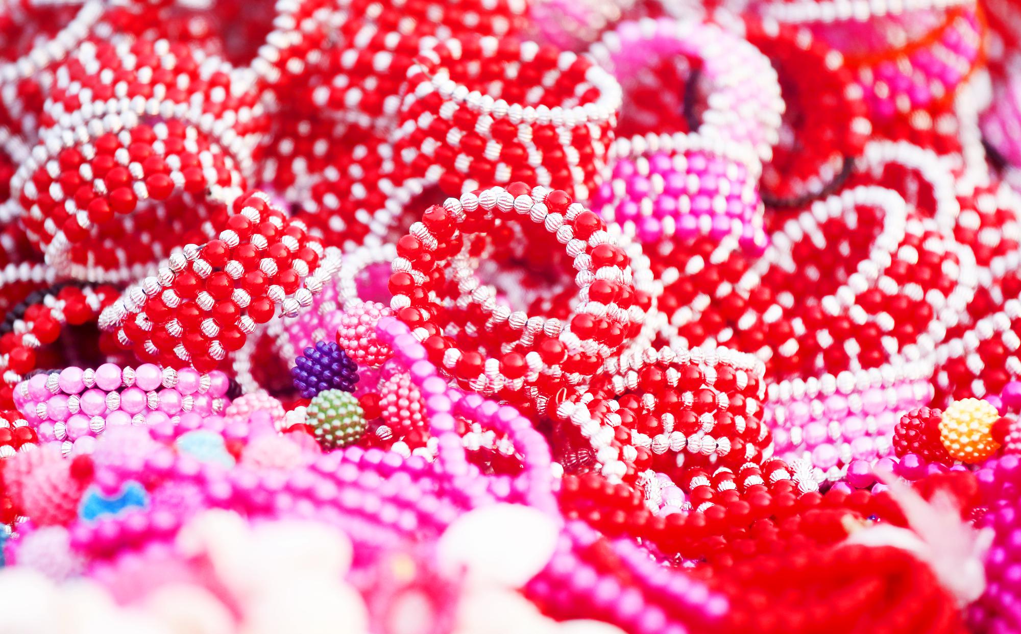 Close detail of satin stitch and beads